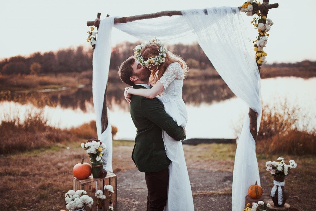 Bride and groom kissing after getting married